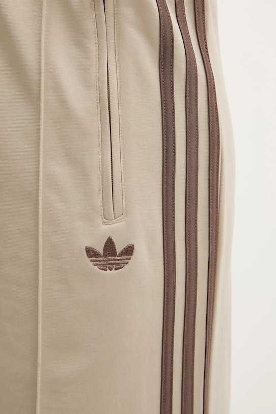 adidas Originals spodnie dresowe Firebird beżowy KD3660