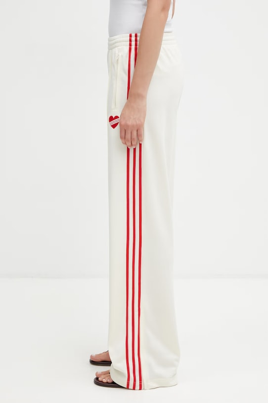 adidas Originals spodnie dresowe damskie beżowy KQ8056