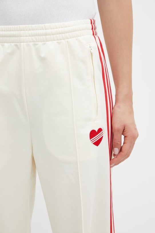 adidas Originals spodnie dresowe damskie beżowy KQ8056