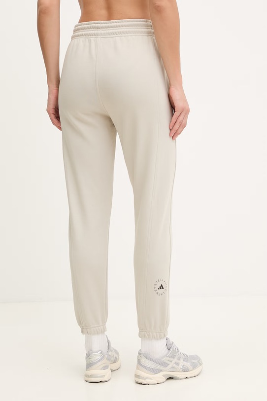Odzież adidas by Stella McCartney spodnie dresowe damskie bawełniane JZ0658 beżowy