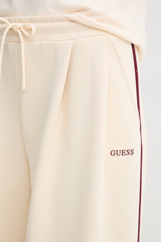 Guess spodnie dresowe damskie JASMINE beżowy V6GB01.K2914