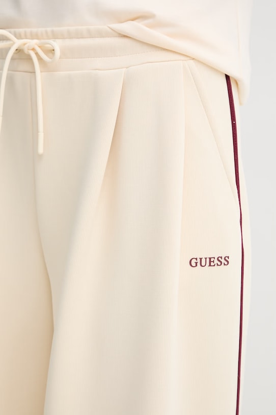 Guess spodnie dresowe damskie JASMINE beżowy V6GB01.K2914