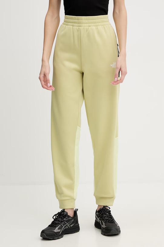 The North Face spodnie dresowe MOUNTAIN ATHLETICS aplikacja żółty NF0A8DXYG731