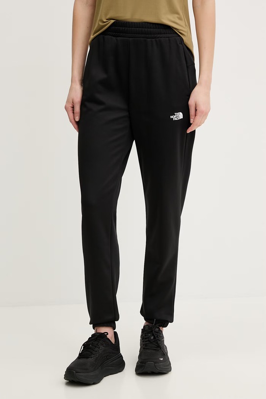 The North Face spodnie treningowe REAXION 2.0 nadruk czarny NF0A8DWAKS71