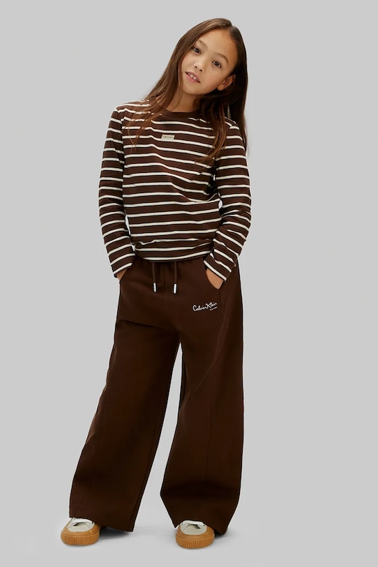 Дитячі бавовняні штани Calvin Klein Jeans аплікація коричневий IG0IG03095.128.176.PPY2