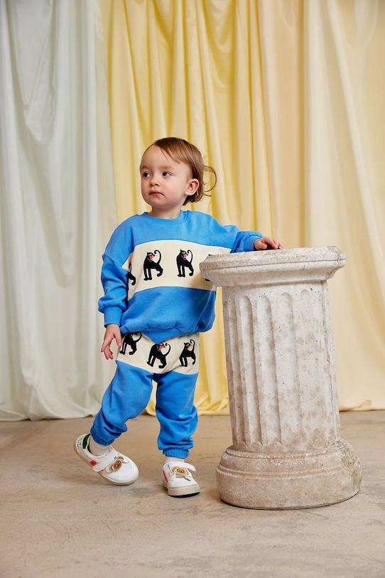 Mini Rodini spodnie dresowe bawełniane dziecięce Panther wzorzyste niebieski 11000342