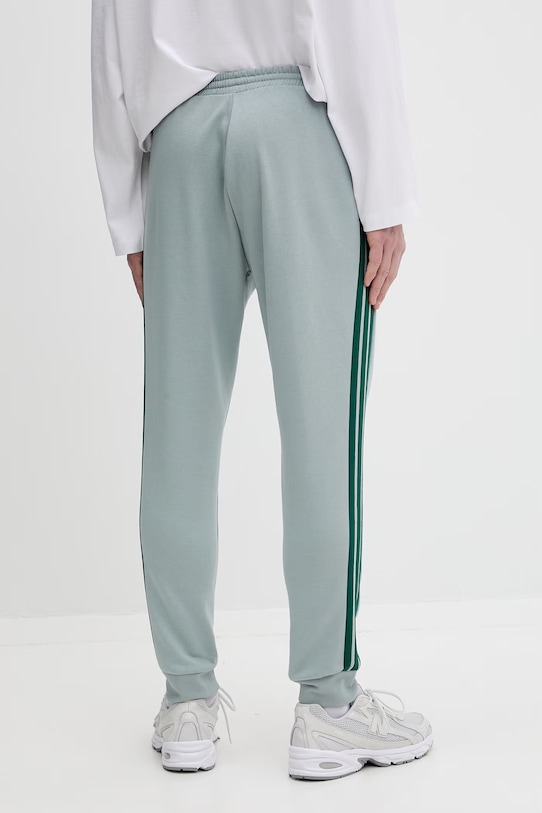 Odzież adidas spodnie dresowe KD4836 turkusowy