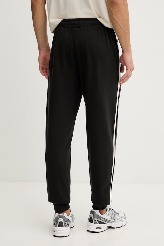 Odzież Puma spodnie dresowe męskie bawełniane Essential Elevated 692055 czarny