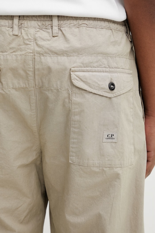 C.P. Company spodnie bawełniane beżowy 20CMPA158A110325G