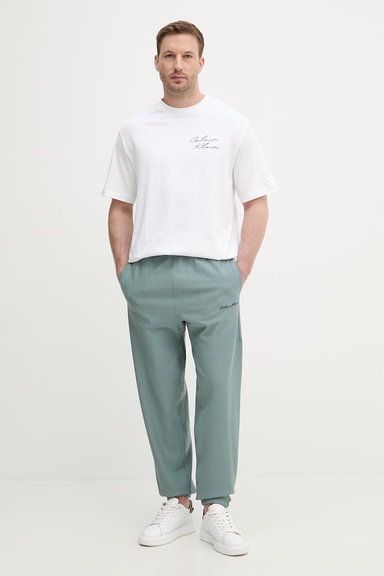 Calvin Klein Jeans teplákové nohavice pánske LV04RF249G zelená SS26