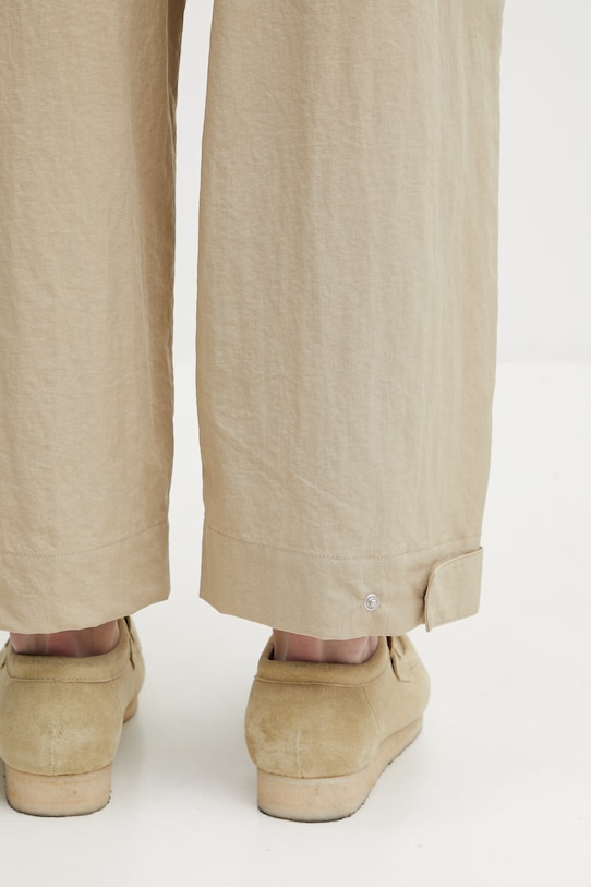 Maison Kitsuné spodnie męskie beżowy QM01106WW9082