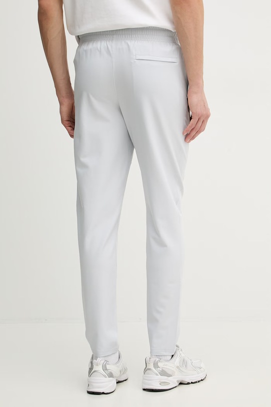 Odzież Under Armour spodnie joggery męskie Unstoppable 6003861 szary