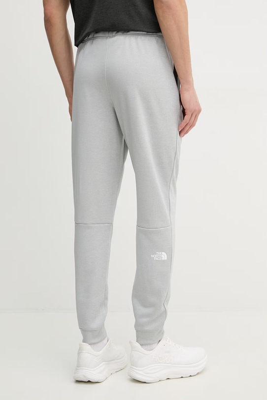 Odzież The North Face spodnie dresowe męskie REAXION NF0A8CNQJKS1 szary