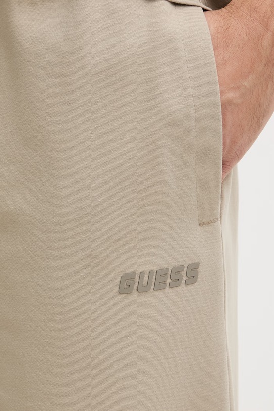 Guess spodnie dresowe męskie GUSTAVE beżowy Z6GB01.K2834
