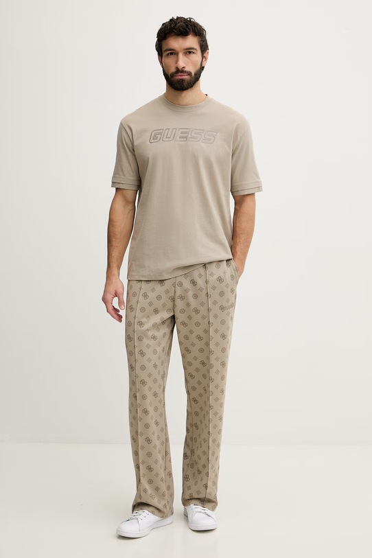 Guess spodnie dresowe męskie OVIDO Z6GB03.K2850 beżowy SS26