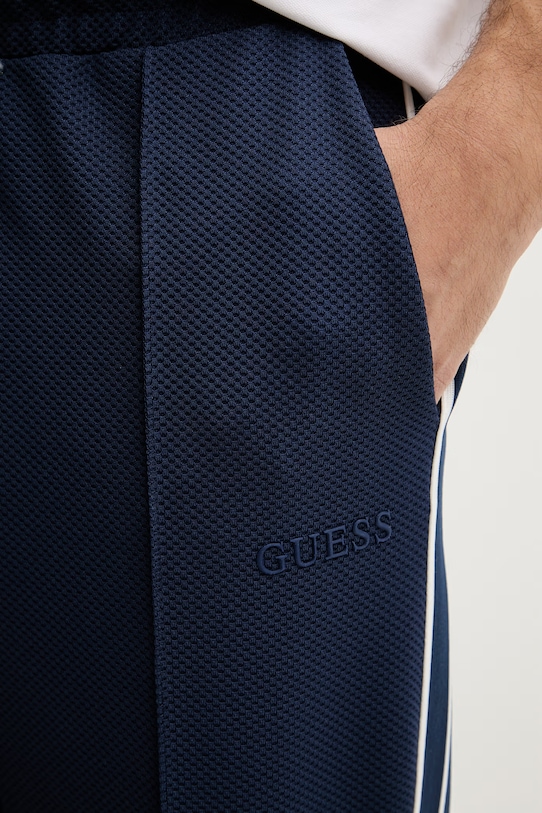 Guess spodnie dresowe męskie SPIROS granatowy Z6GB14.K3211