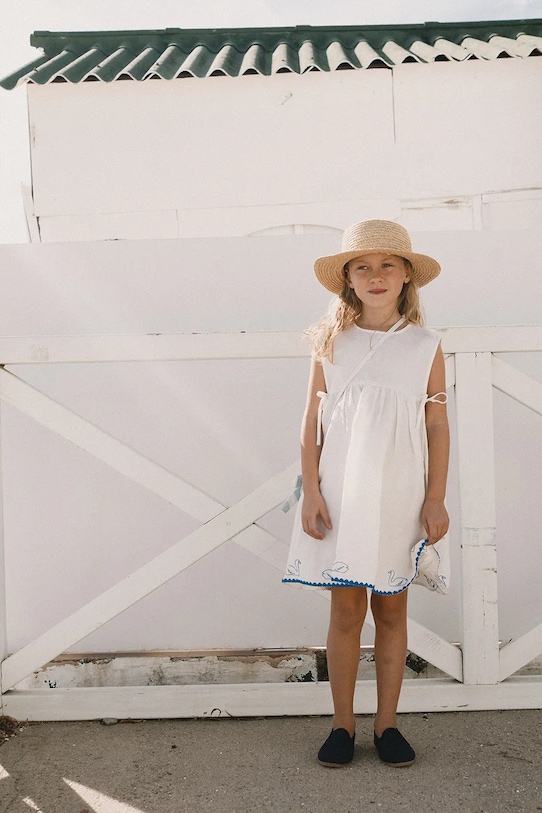 Tinycottons sukienka z dodatkiem lnu dziecięca SWANS BOWS DRESS SS26.229 biały