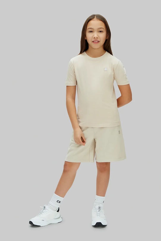 Calvin Klein Jeans teplákové šortky dětské s bavlnou béžová LV1CKSJC52.128.176.PPY2