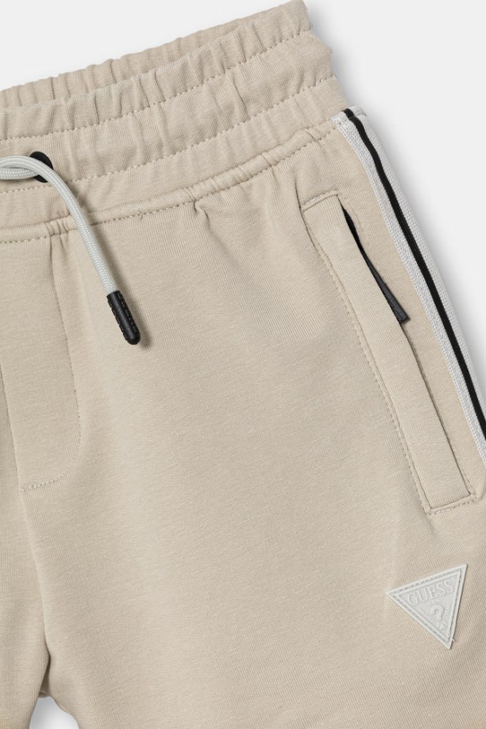 Chłopiec Guess szorty dresowe dziecięce bawełniane z elastanem L6GD17.K6ZS1.PPY2.M beżowy