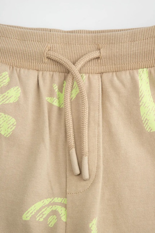 Chlapec Coccodrillo teplákové šortky detské bavlnené WC6121502TBK béžová