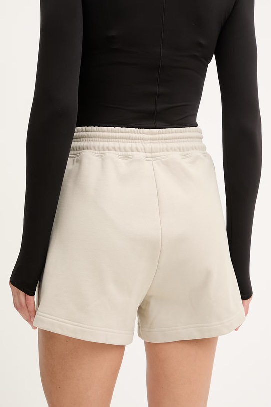 Odzież adidas by Stella McCartney szorty dresowe damskie bawełniane KC1821 beżowy