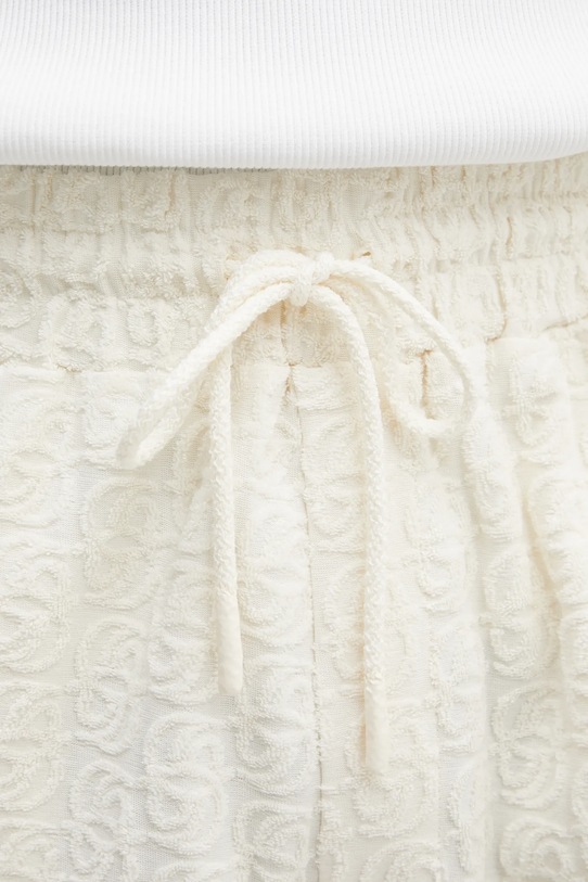 Bavlněné šortky Drôle de Monsieur Monogramme béžová J.BS158.CO201.OW