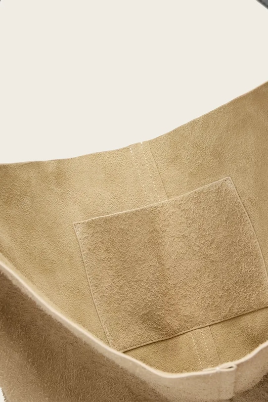 Semišová kabelka AllSaints ASHA W518XD béžová