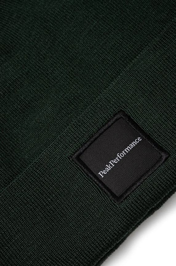Kapa s dodatkom vune Peak Performance Switch G77781 zelena AW25