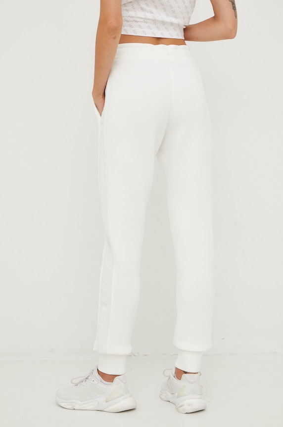 Ρούχα Παντελόνι φόρμας Guess ALLIE V2YB18.K7UW2 λευκό