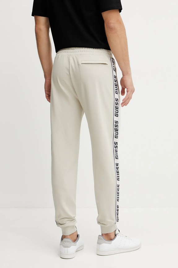 Tepláky Guess Z2YB19.K6ZS1 béžová SS26
