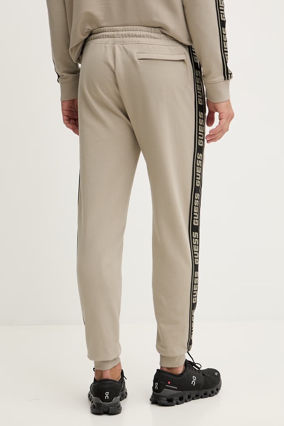 Ρούχα Παντελόνι φόρμας Guess Z2YB19.K6ZS1 μπεζ