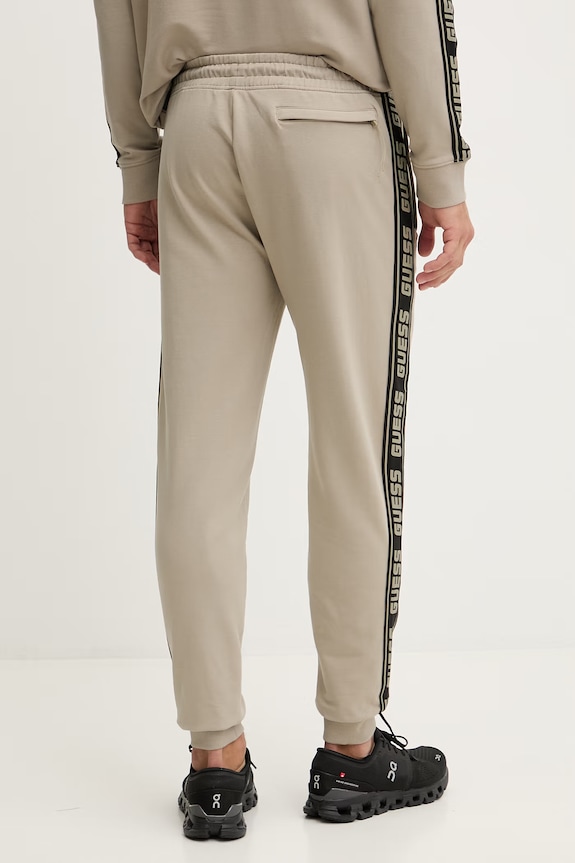 Ρούχα Παντελόνι φόρμας Guess Z2YB19.K6ZS1 μπεζ