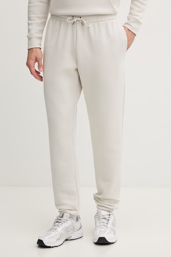 Under Armour spodnie dresowe męskie z bawełną Essential Fleece beżowy 1373882