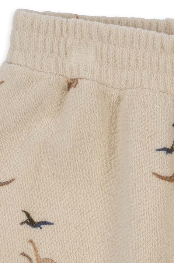 Konges Sløjd spodnie dresowe bawełniane dziecięce beżowy KS6416