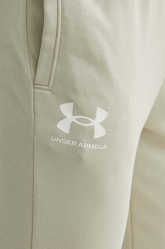 Under Armour spodnie dresowe beżowy 1380843