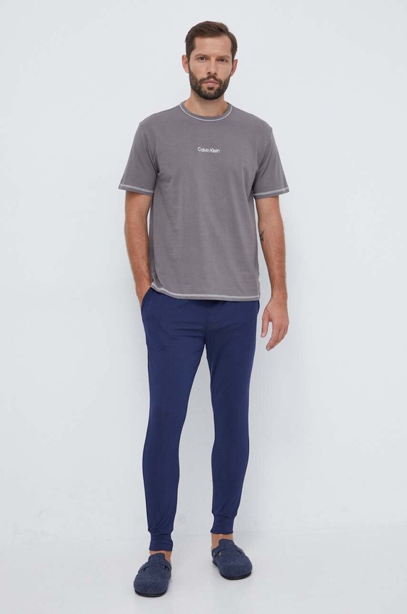 Nohavice Calvin Klein Underwear 000NM2235A tmavomodrá AW24