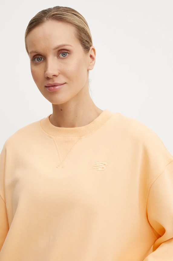 New Balance bluza bawełniana pomarańczowy WT41500PAE