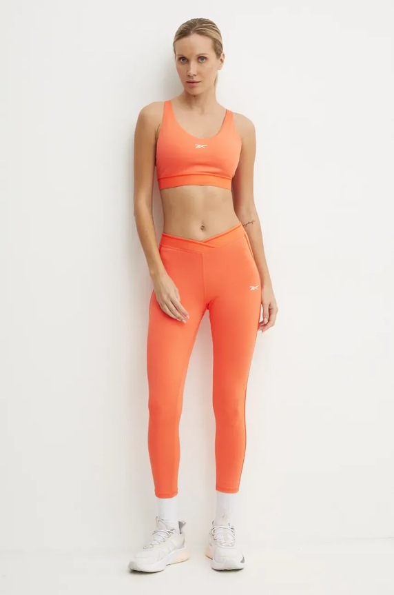 Reebok legginsy treningowe Team 100205708 pomarańczowy AW24