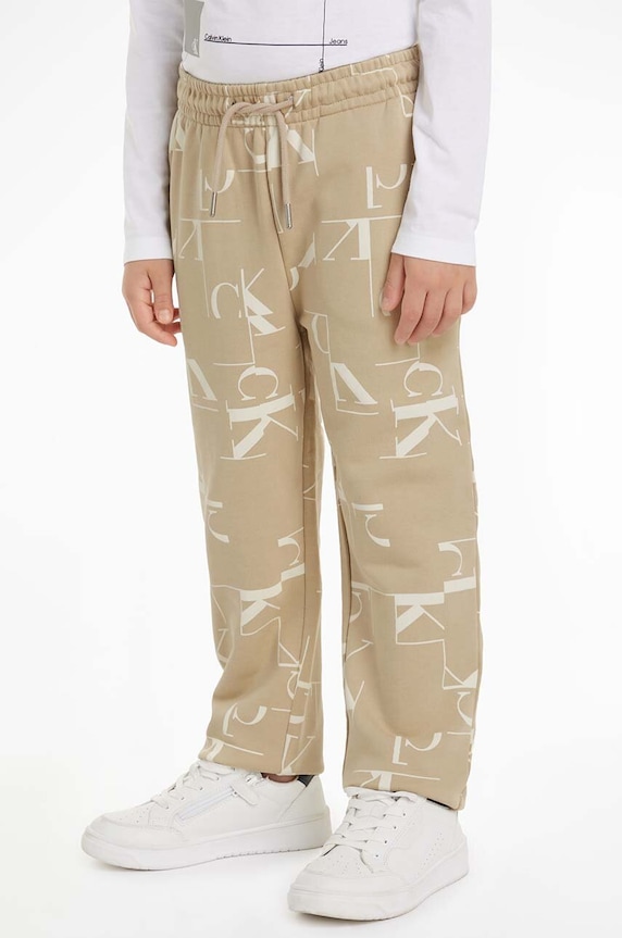 Calvin Klein Jeans spodnie dresowe bawełniane dziecięce TERRY JOGGER nadruk beżowy IB0IB02124.9BYH