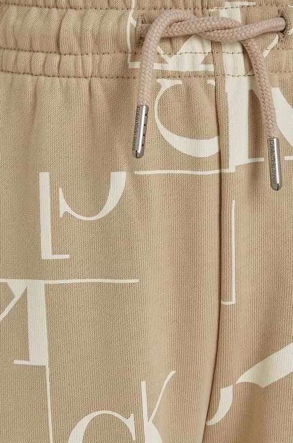 Calvin Klein Jeans spodnie dresowe bawełniane dziecięce TERRY JOGGER beżowy IB0IB02124.9BYH
