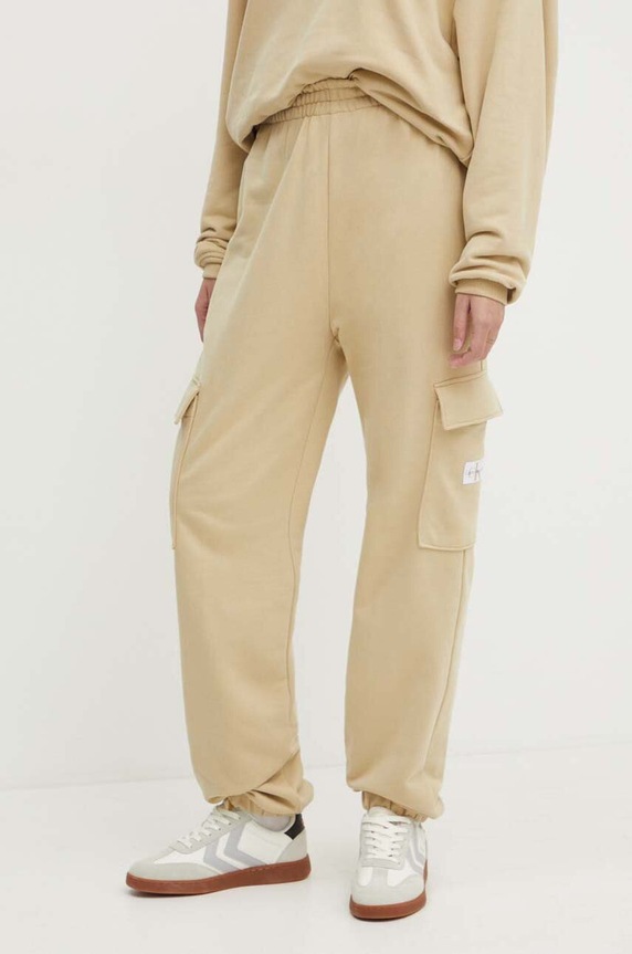Bavlnené tepláky Calvin Klein Jeans bavlna béžová J20J223589