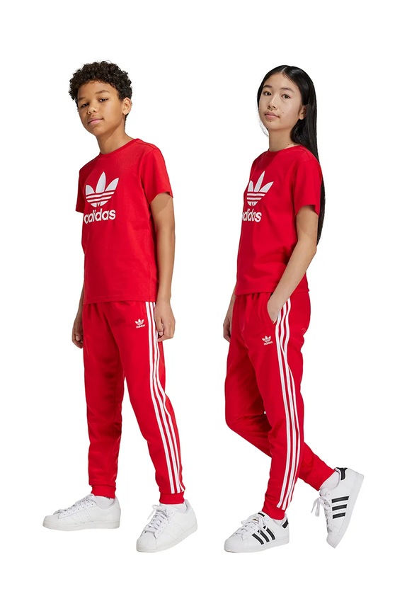 adidas Originals gyerek melegítőnadrág SST TRACK PANTS aplikációval piros IX7631