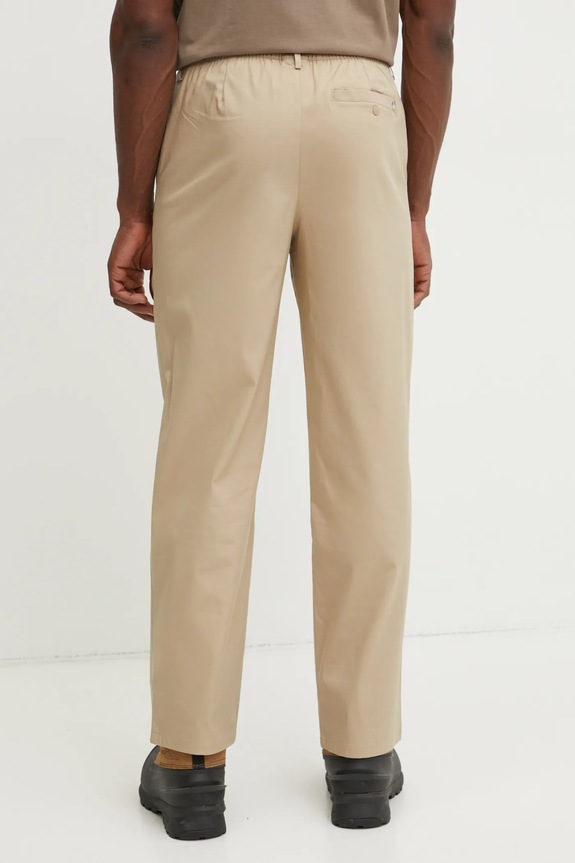 Odzież New Balance spodnie Athletics Standard Pant 30" MP43560SOT beżowy