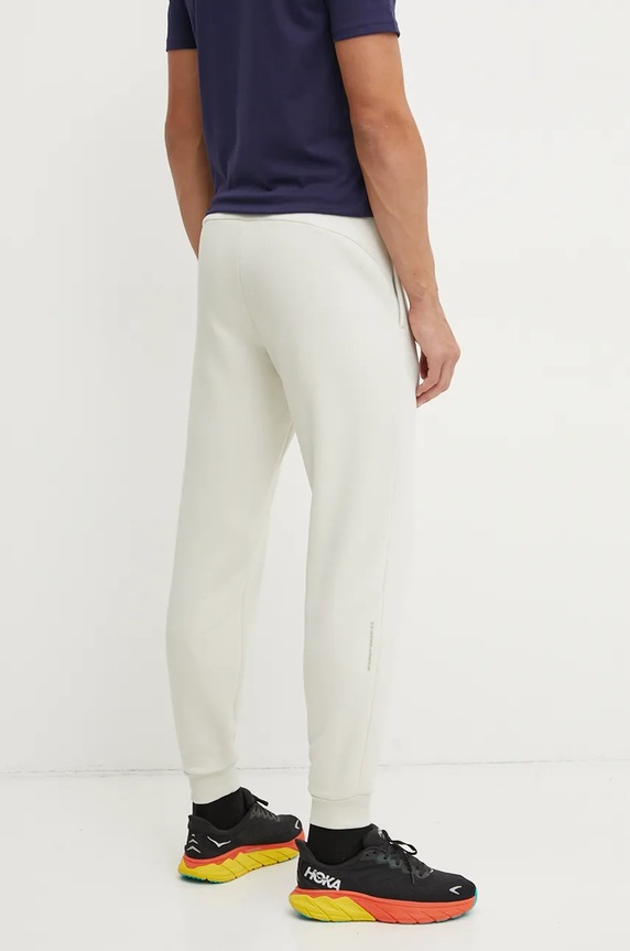 Odzież Under Armour spodnie dresowe Armour Fleece Pro 1386586 beżowy