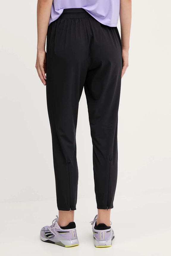 Odjeća Under Armour donji dio trenirke za žene Velocity 6004020 crna