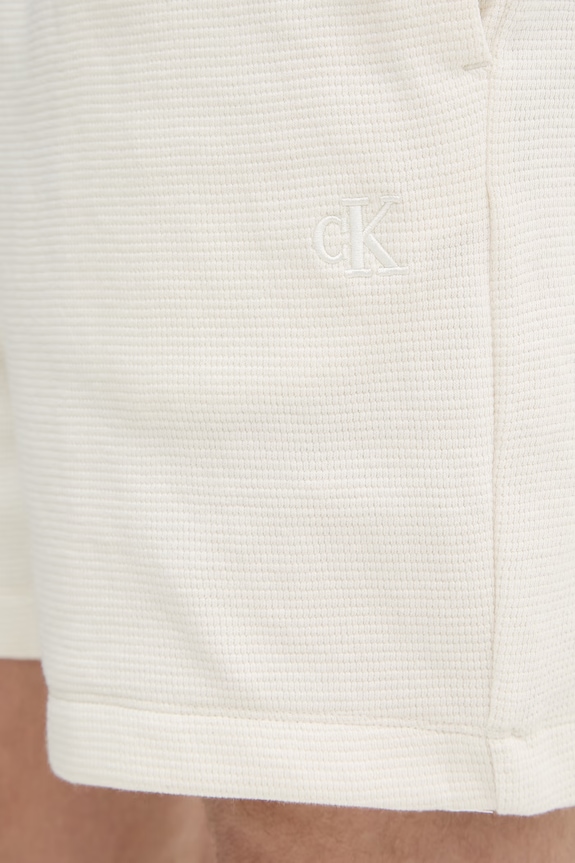 Calvin Klein Jeans teplákové šortky pánske bavlnené béžová LV04RC248G