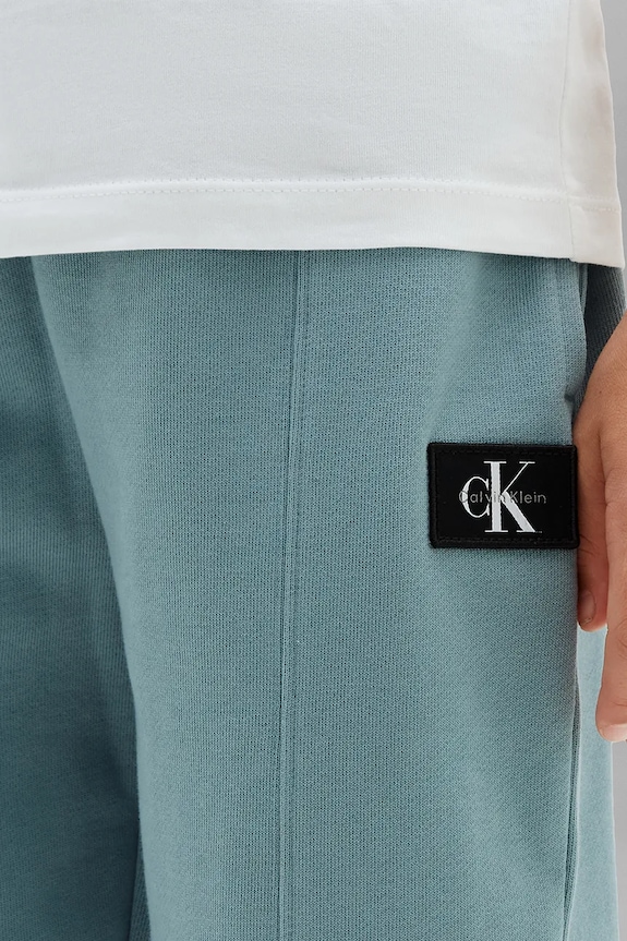 Calvin Klein Jeans teplákové nohavice detské bavlnené LVCKTJC42B.128.176.9BY2 modrá