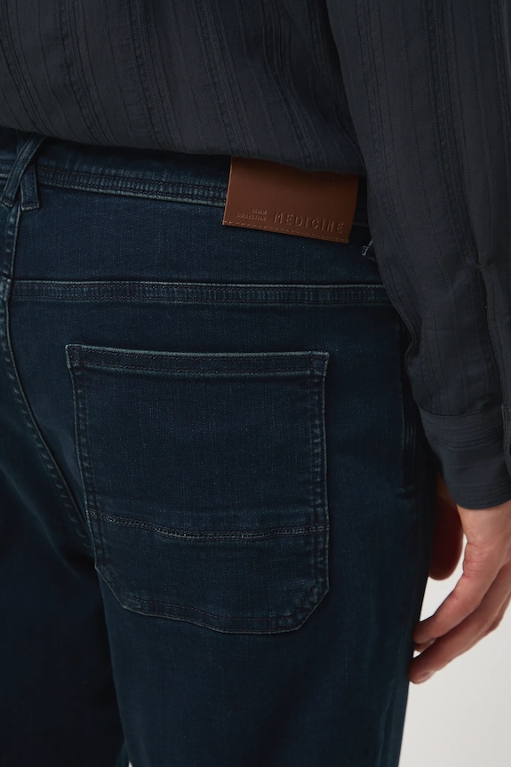 Jeansy męskie tapered z efektem sprania granatowy RW25-SJM702