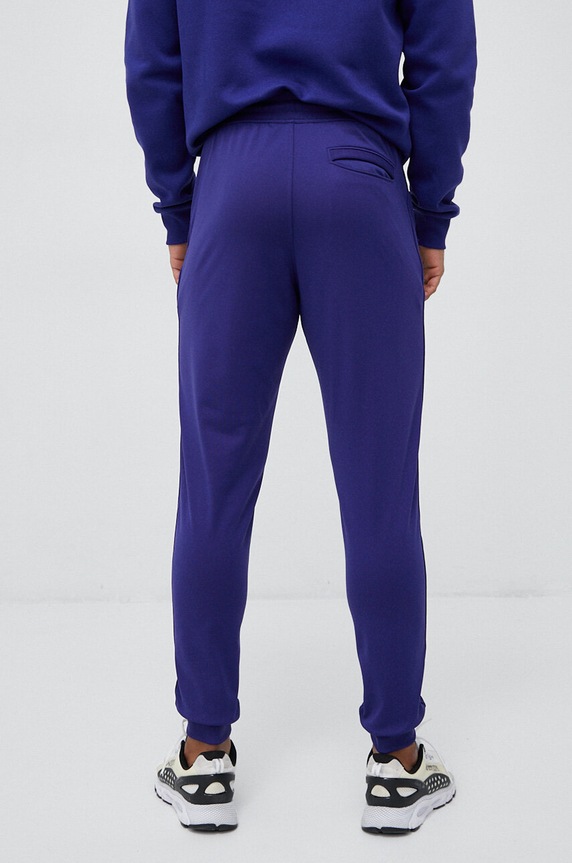 Ρούχα Παντελόνι φόρμας Under Armour 1290261 μωβ