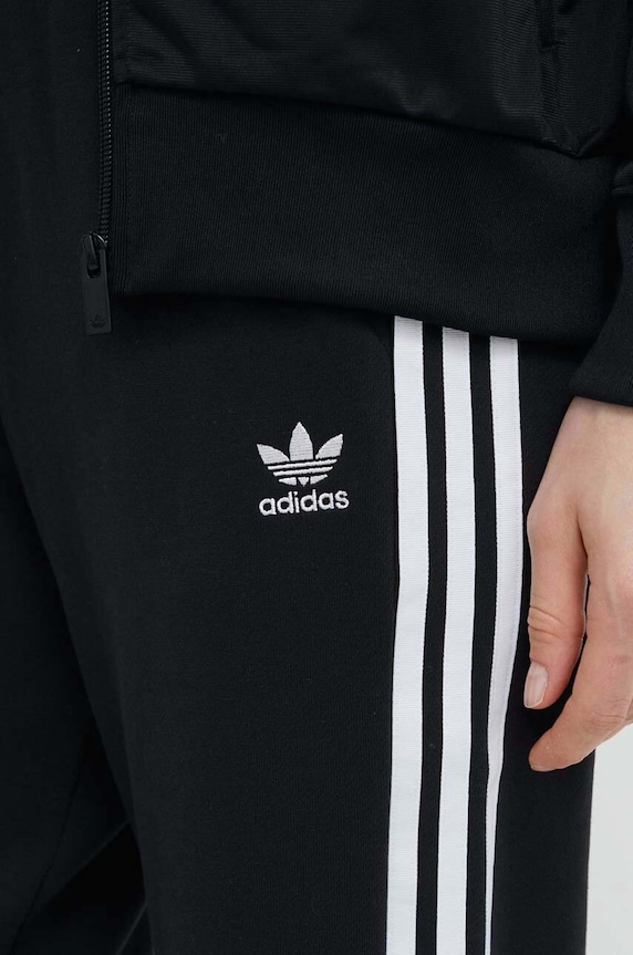 Bavlněné tepláky adidas Originals černá IB7457